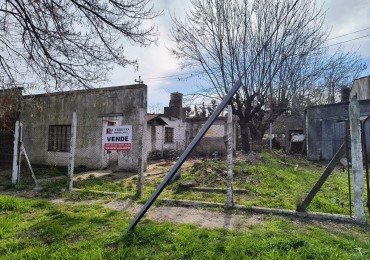 AMPLIO TERRENO CON MEJORAS